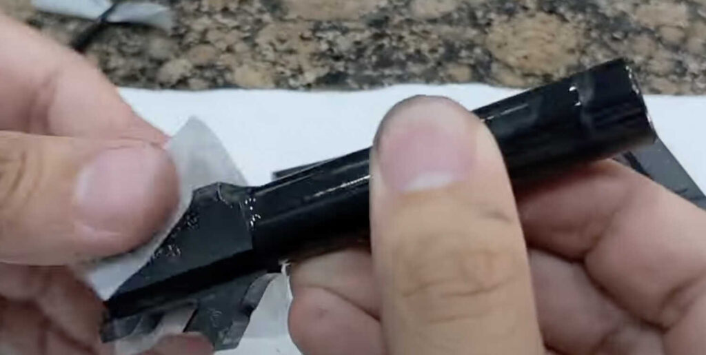 Apply oil to the outside of the Springfield XD barrel and where the chamber meets the slide