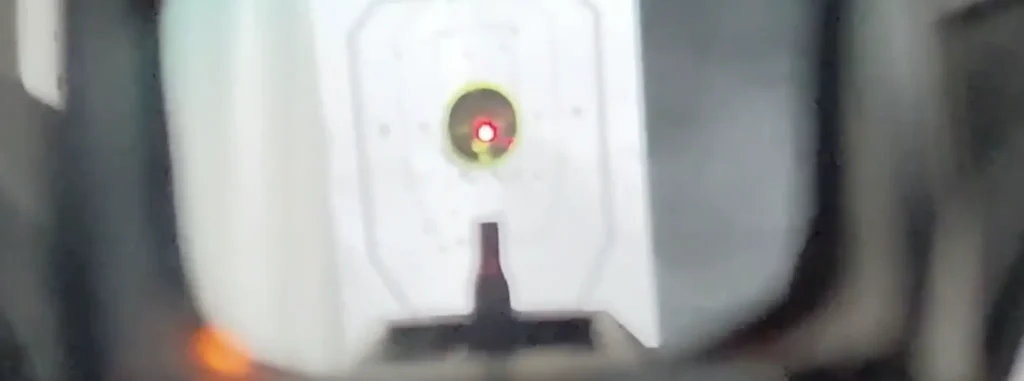 Without the gun clamped in, aim for a distinct point on the target